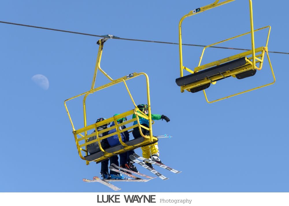 Wedding photos: couple cuts cake; guests dance at reception with elegant decor and lighting.