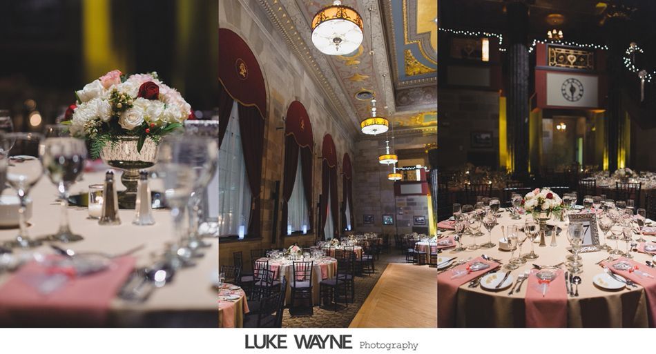 Wedding reception: tables set with floral centerpieces, in an ornate hall with high ceilings and decorative lighting.