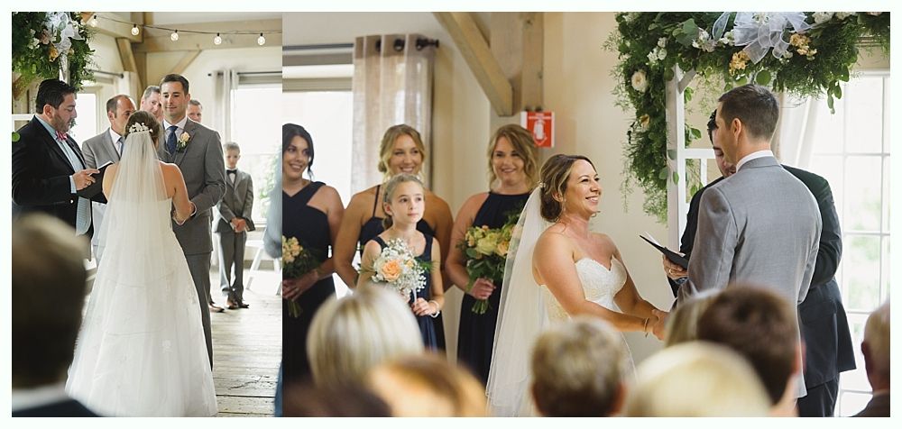 Wedding ceremony with bride, groom, and bridal party indoors.