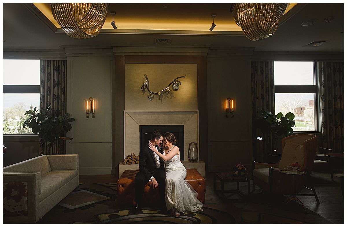 People dancing at a wedding reception; a woman in blue laughs, another makes a peace sign.