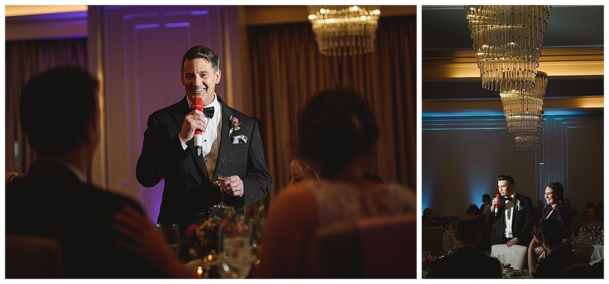 Man giving a wedding speech. He's wearing a suit and holding a microphone. Other people are seated.