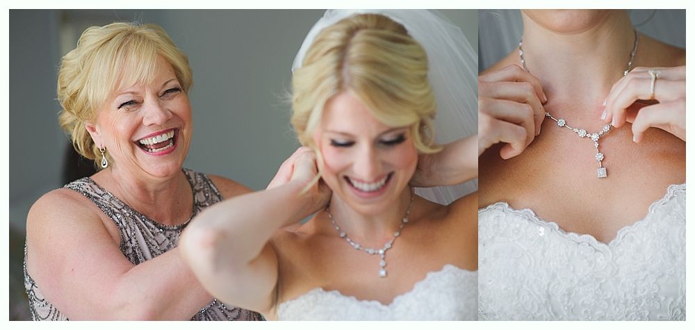 Bride in white gown holding bouquet, posed outdoors. Sunlight streams through trees.