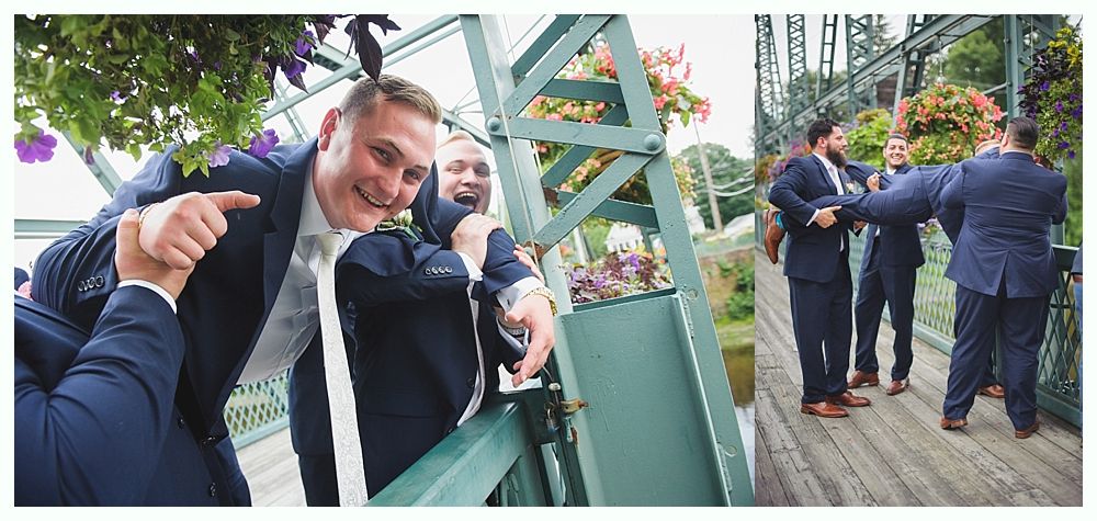 Bride with arms up, making a funny face, groom looking at his hand, cake cutting in background.