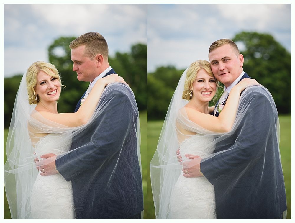 Bride with arms up, making a funny face, groom looking at his hand, cake cutting in background.