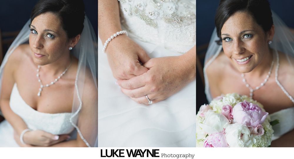 Bridesmaids in pastel dresses and bride in white, walking down a road, holding bouquets, sunny day.