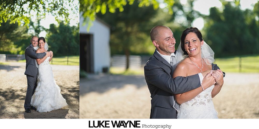 Bride and father dance at wedding reception, smiles and chandeliers overhead.