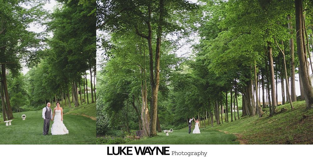 Wedding party carrying bride indoors with paper lanterns.