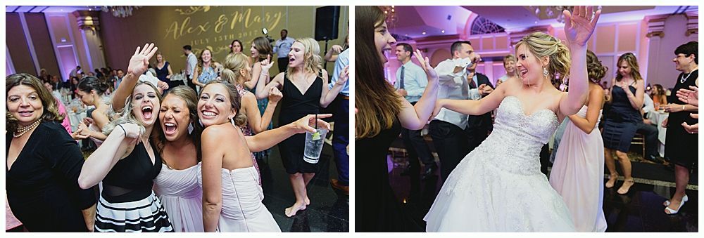Wedding reception: Bride and guests dancing in a brightly lit ballroom. Joyful expressions, arms raised.