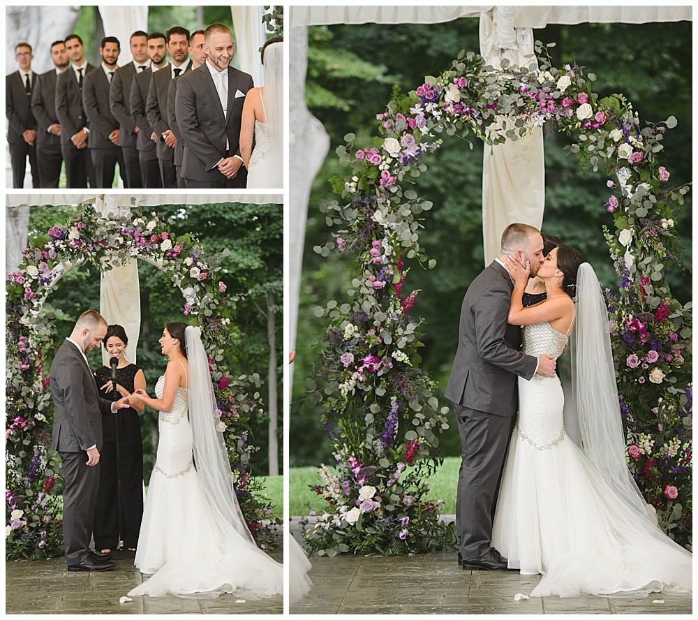 Wedding ceremony: couple under floral arch, exchanging vows, kissing. Groomsmen stand nearby.