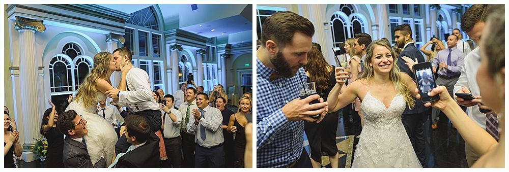 Wedding group photo. Bride and groom pose with bridesmaids and groomsmen inside.