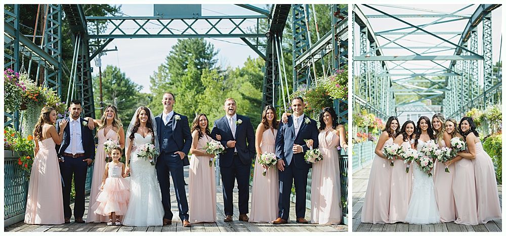 Wedding party posing on a bridge; bride and groom centered with bridesmaids in pink and groomsmen in navy.
