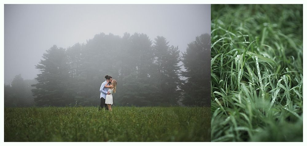 Couple embracing in a field with tall grass, trees in the background shrouded in fog.