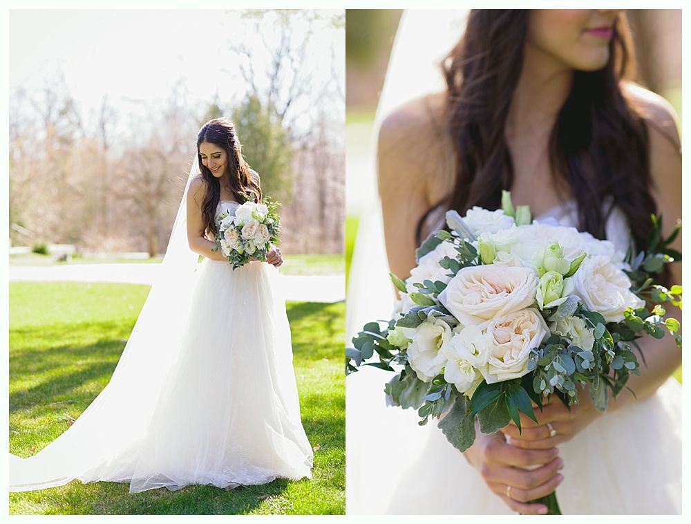 Bride in a white gown holding a bouquet; outdoor setting with greenery and sunlight.