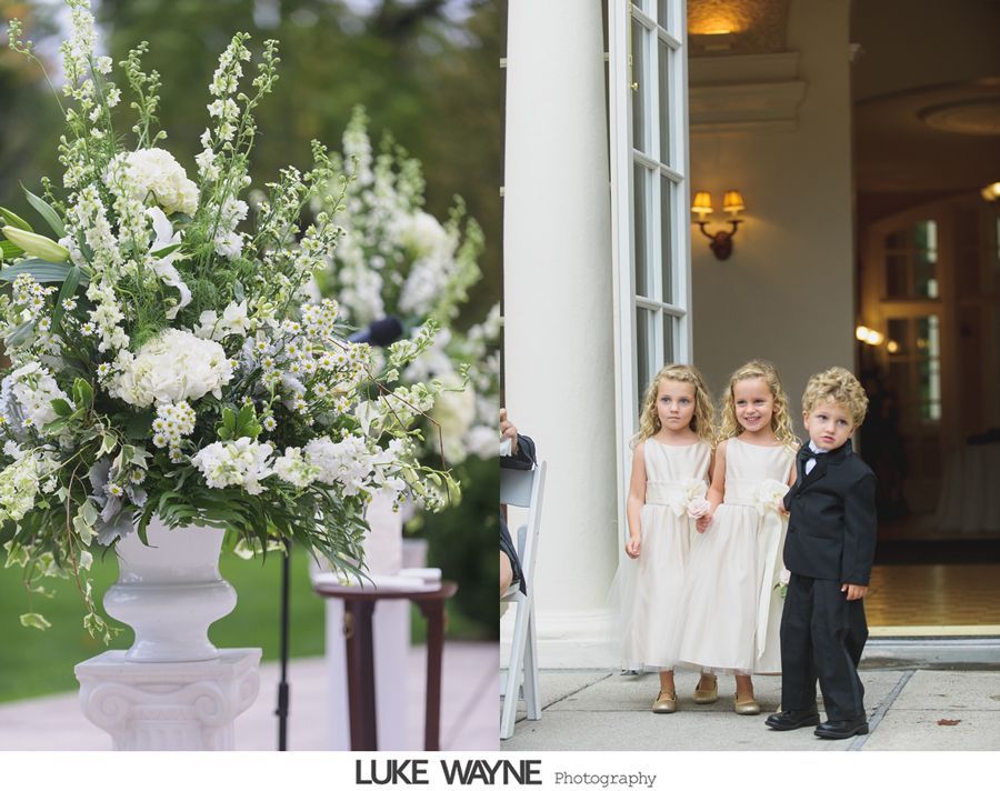 Wedding scene with flower arrangement and children in formal attire.
