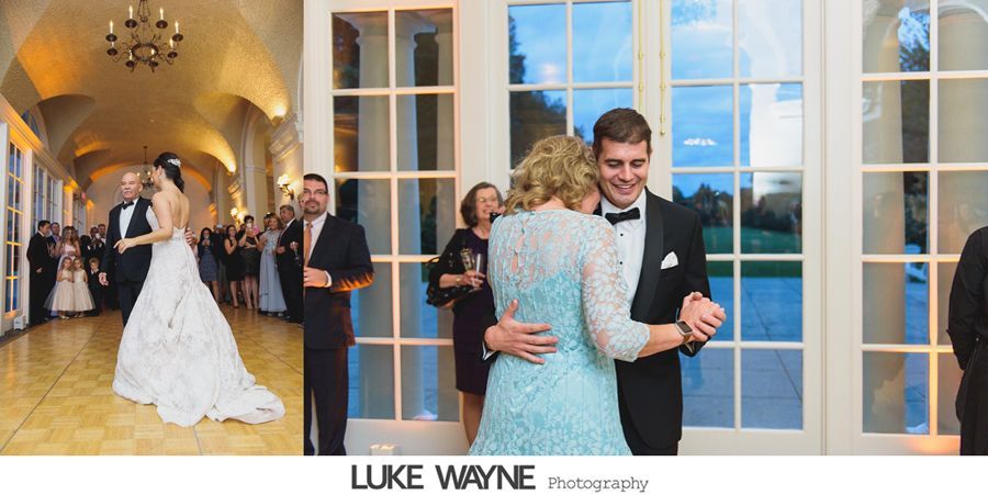 Wedding reception: Bride and groom dancing, plus guests. Ballroom with large windows.