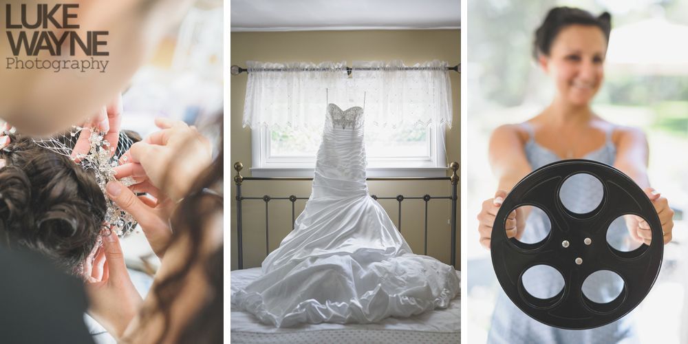 Woman laughs joyfully outdoors, hand in hair, wearing denim jacket and floral dress.