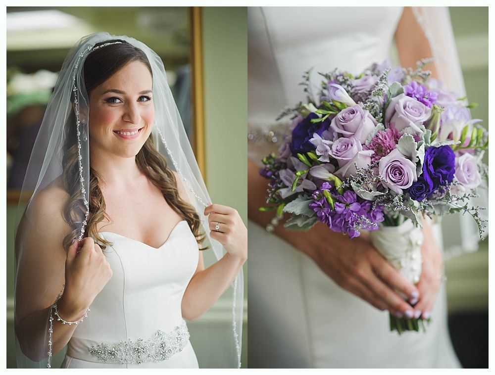 Bride with arms up, making a funny face, groom looking at his hand, cake cutting in background.