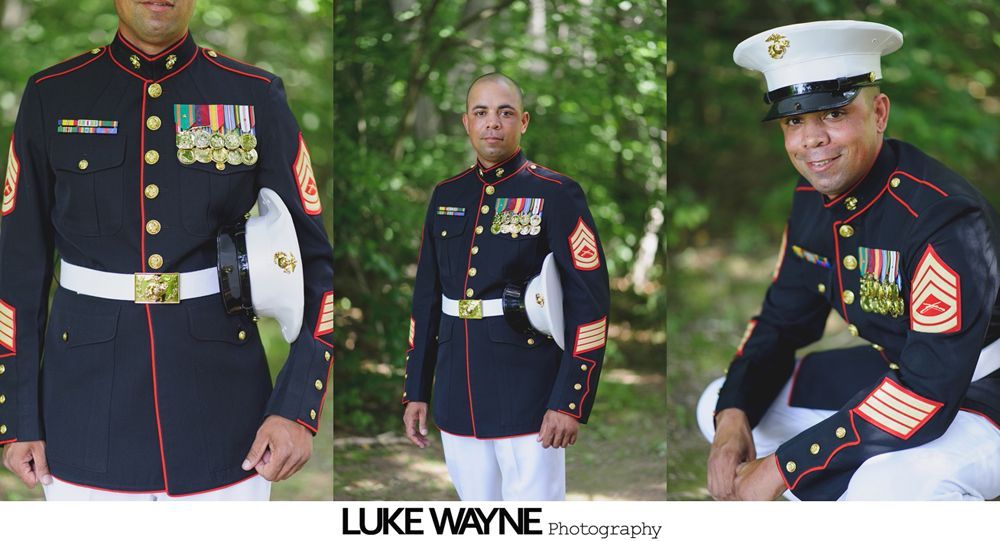 Marine in dress blue uniform, holding cover, posed outdoors.