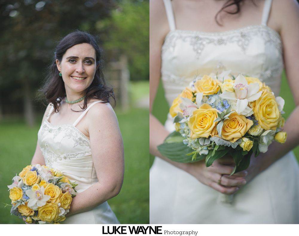 Bride and father dance at wedding reception, smiles and chandeliers overhead.