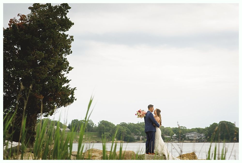 Wedding decorations: flowers on chair, welcome sign, arch with flowers.