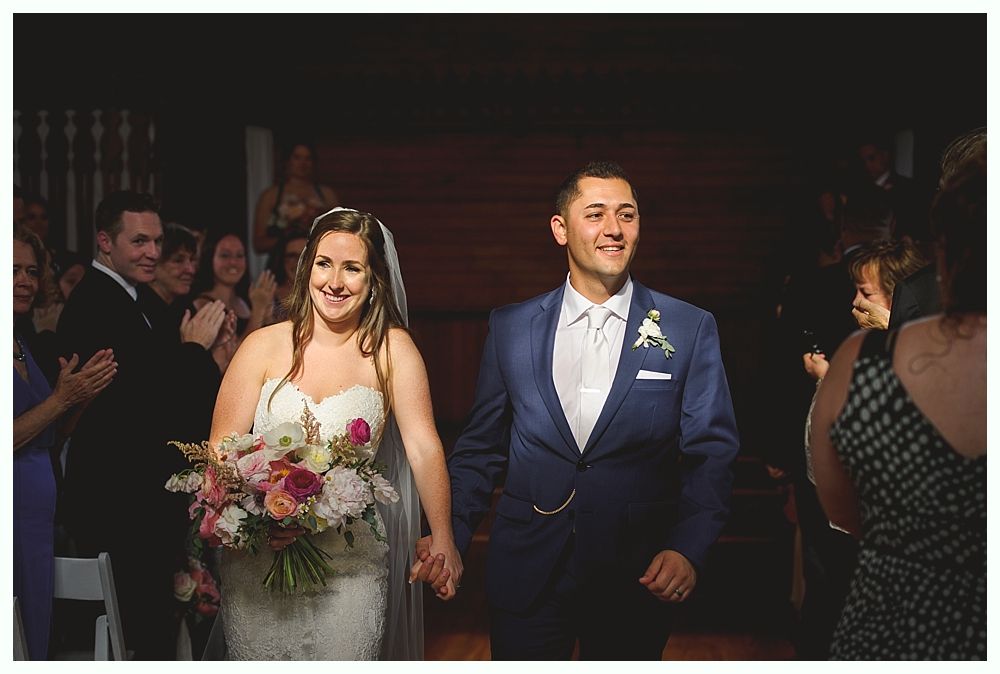 Wedding table setting with centerpiece: black lantern, floral wreath, 