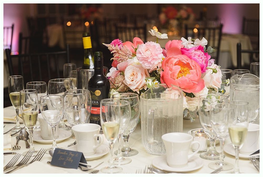 Wedding reception details: barn, table settings, lantern centerpiece, menu, favors.