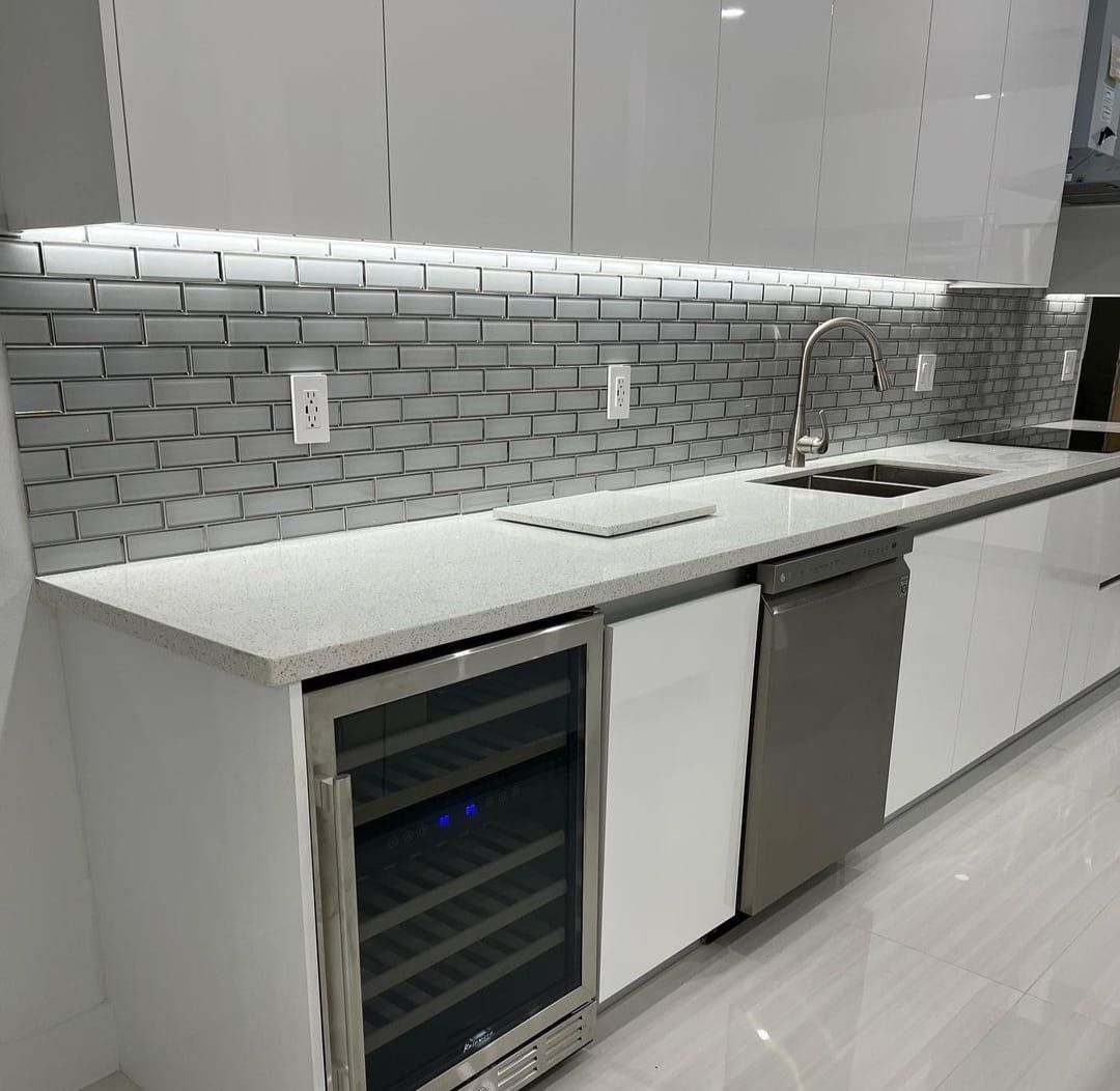 A bathroom with two sinks , a tub , and a walk in shower.