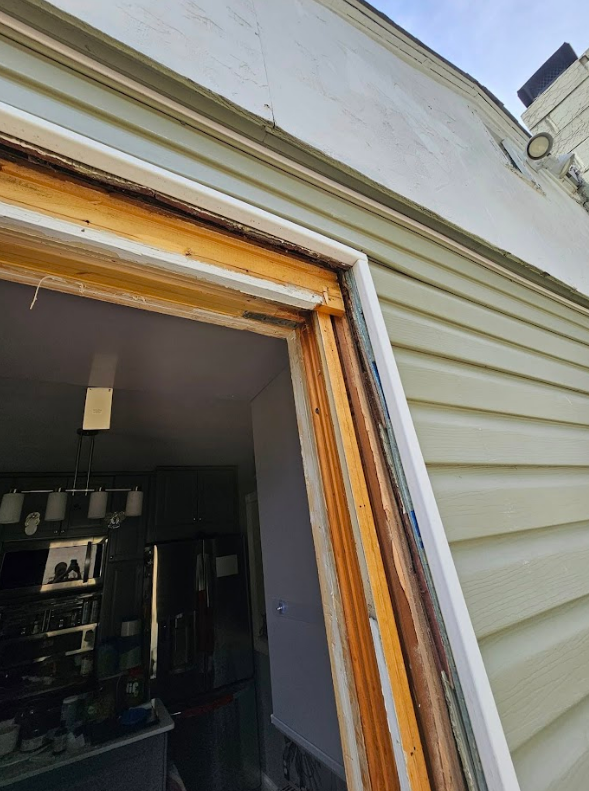 A picture of a window frame on a house.