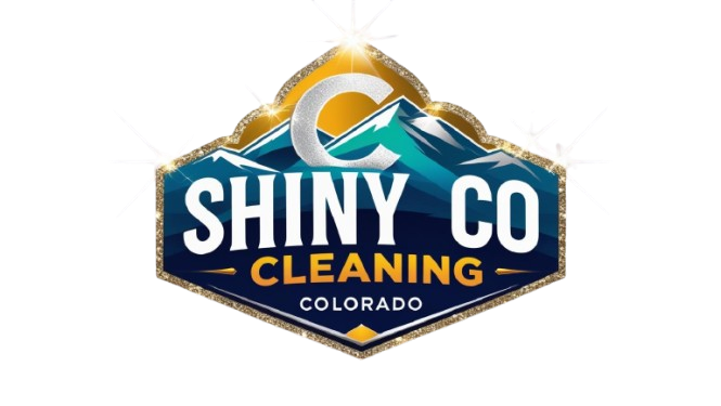 Logo for Shiny Co Cleaning in Colorado, featuring a blue and white mountain scene within a gold and blue hexagon, and the letter 