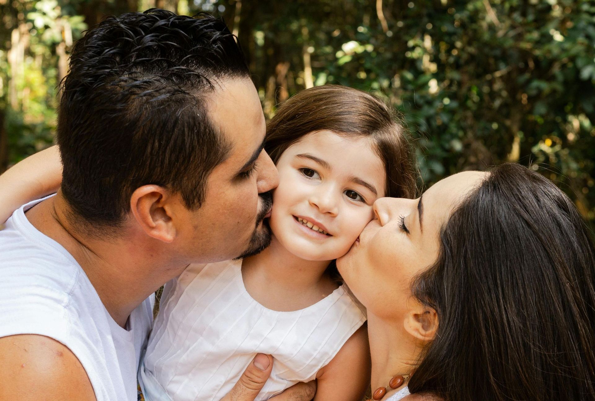 happy family, kissing their child