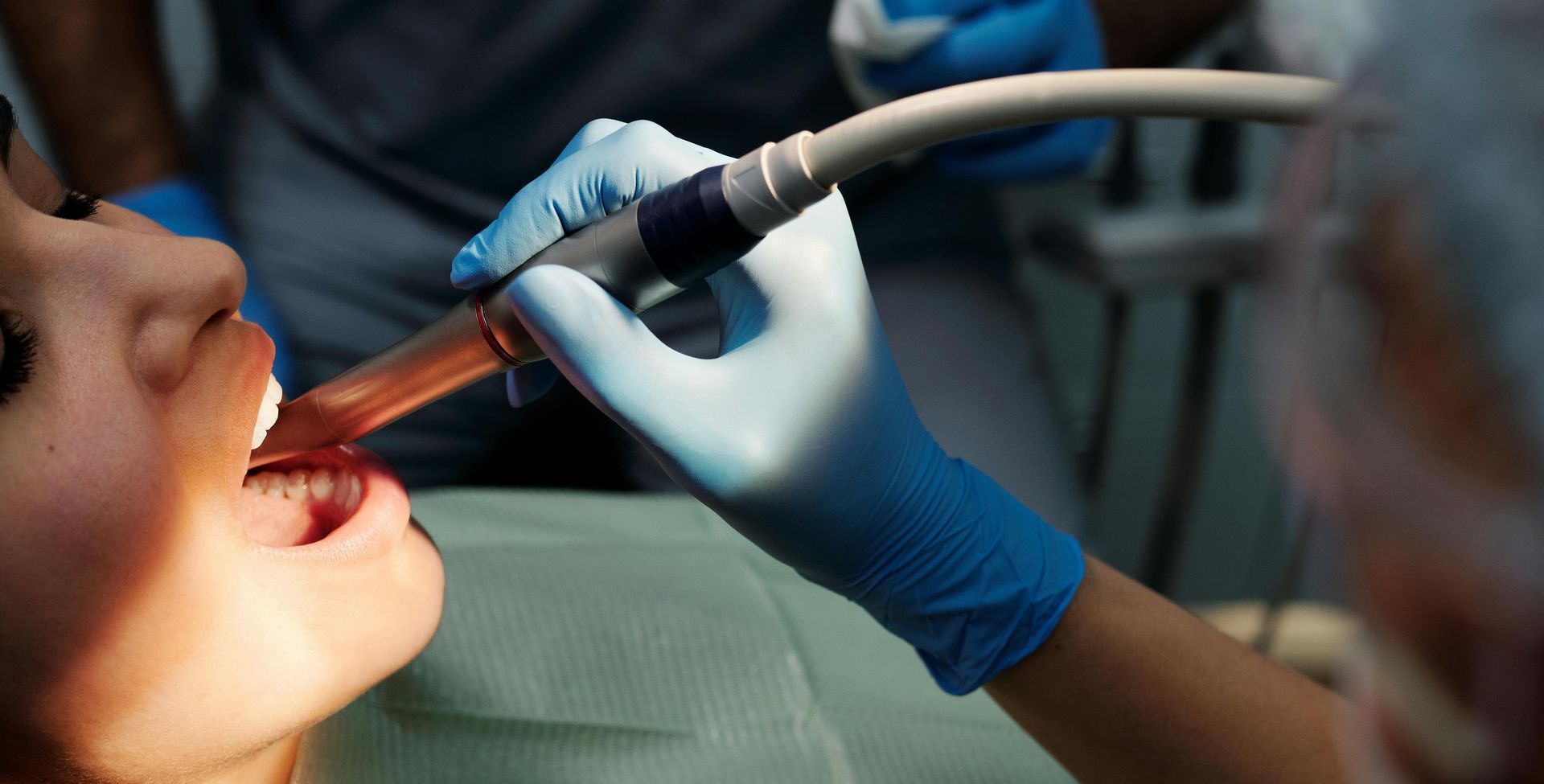 Person at a dental office getting their teeth clean