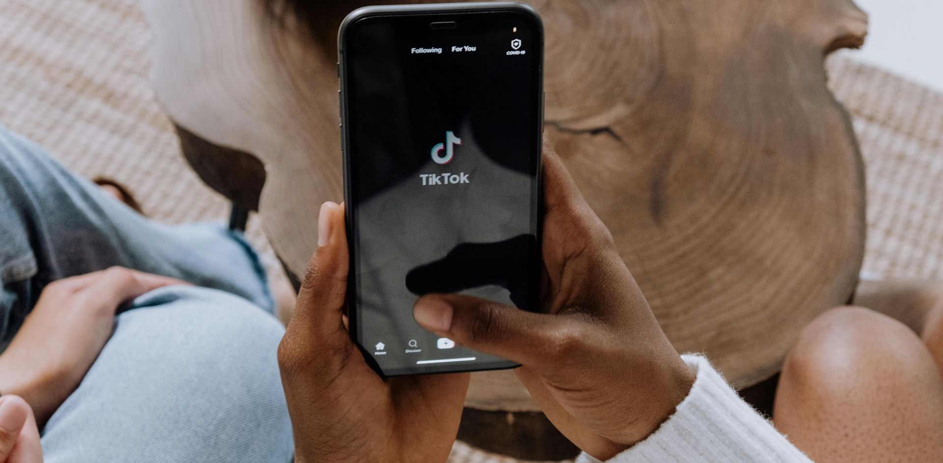 Person looking at tiktok on a cell phone.