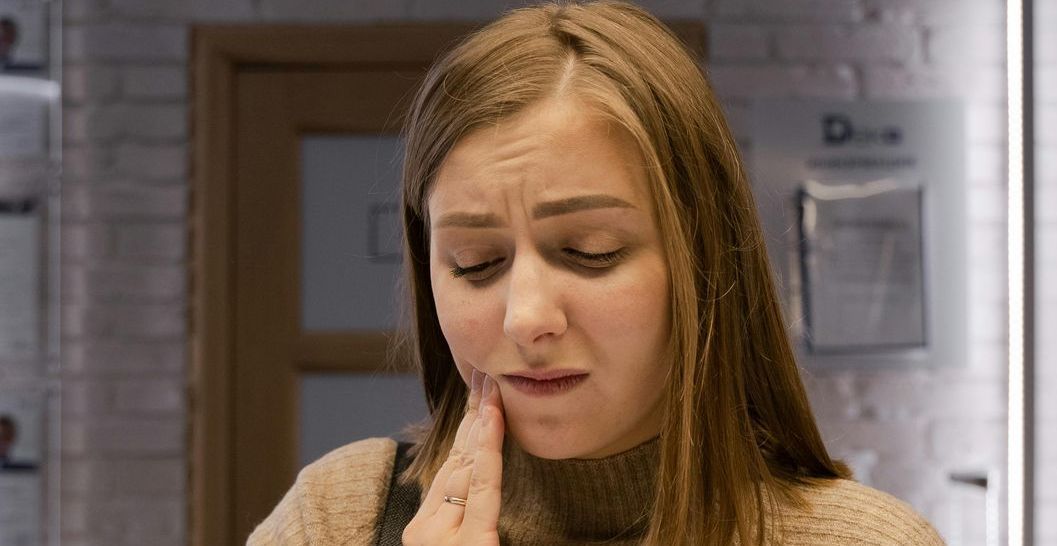 Woman with teeth pain