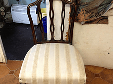 brown coloured chair with a cushion