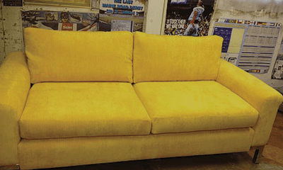 yellow coloured sofa