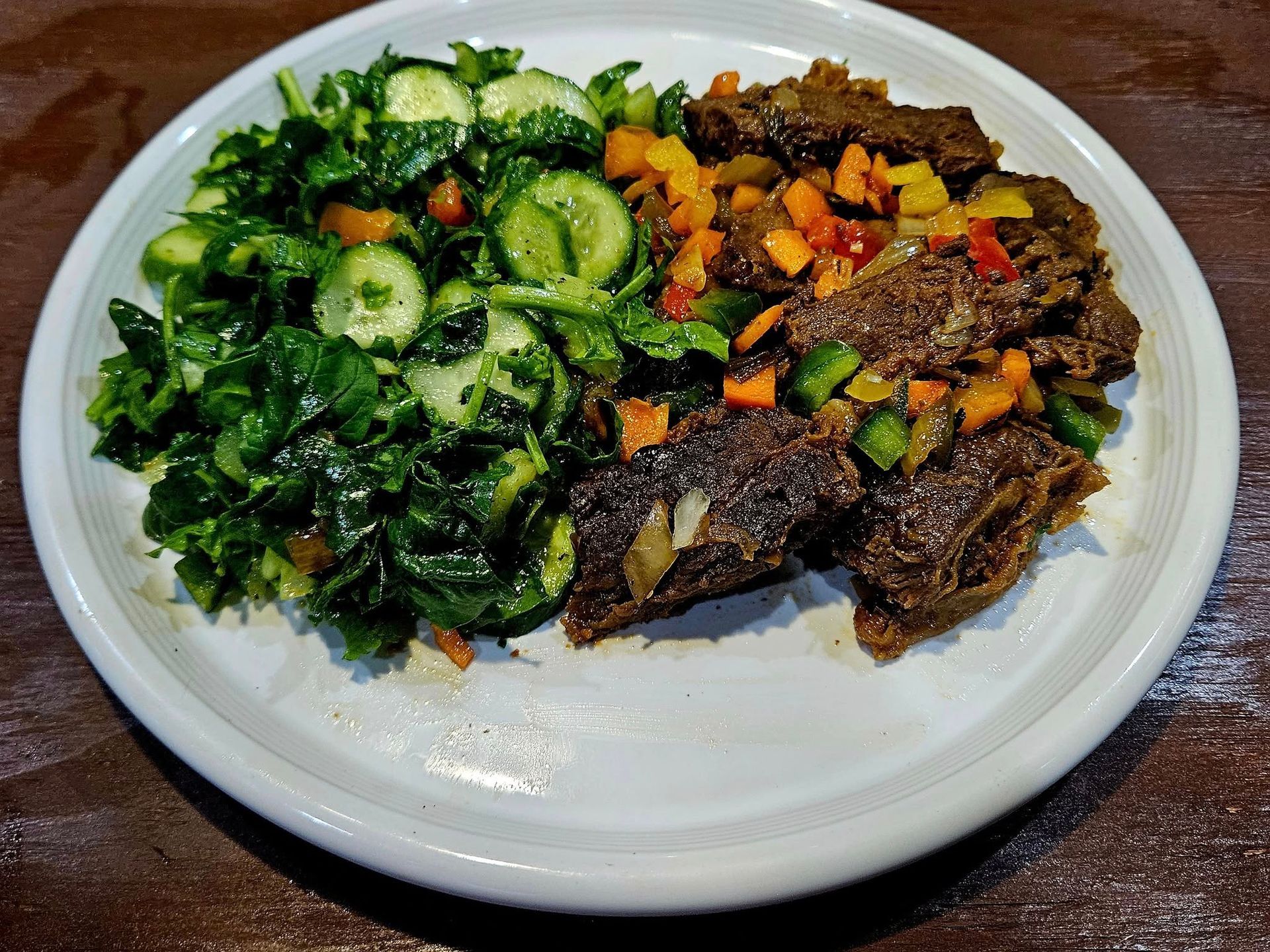 The flag of jamaica is on a black wooden background