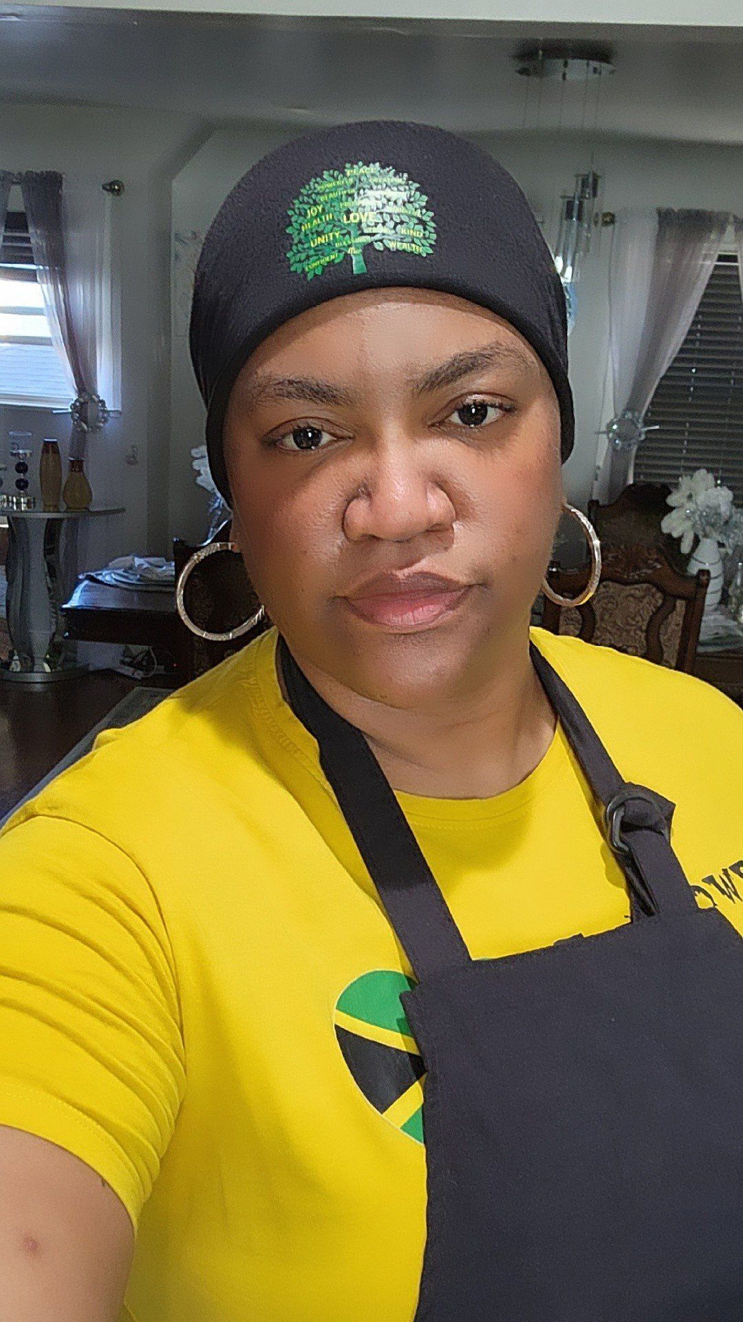 Two men are serving food in a restaurant with an exit sign in the background