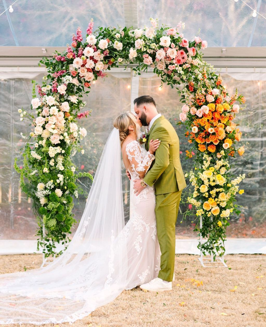 Woman holding bridal bouquet in front of face