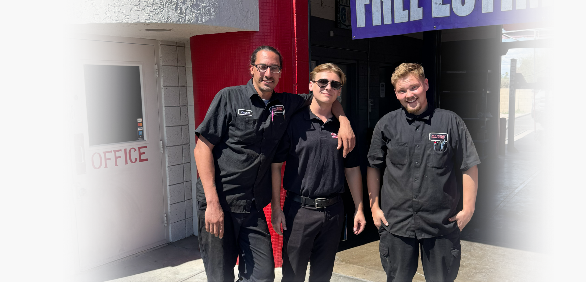 Orange SUV with an open hood in a garage. | All Valley Car Care