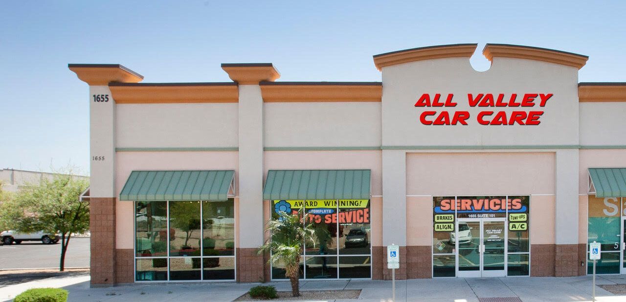 All Valley Car Care storefront with red signage and green awnings. | All Valley Car Care