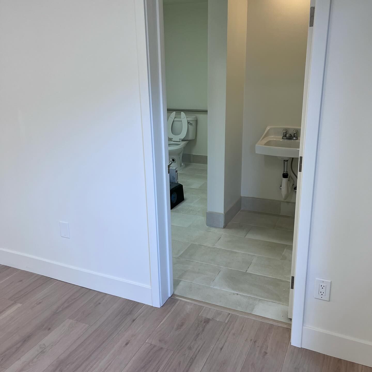 A bathroom with a toilet and sink in it