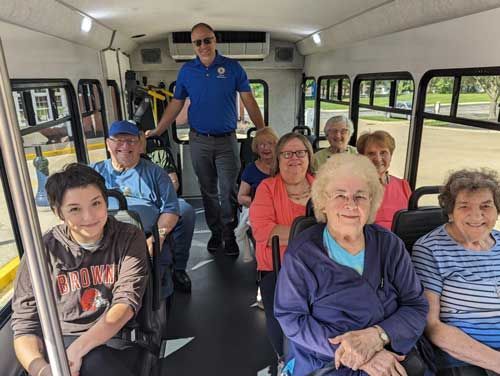 A group of people are sitting on a bus.