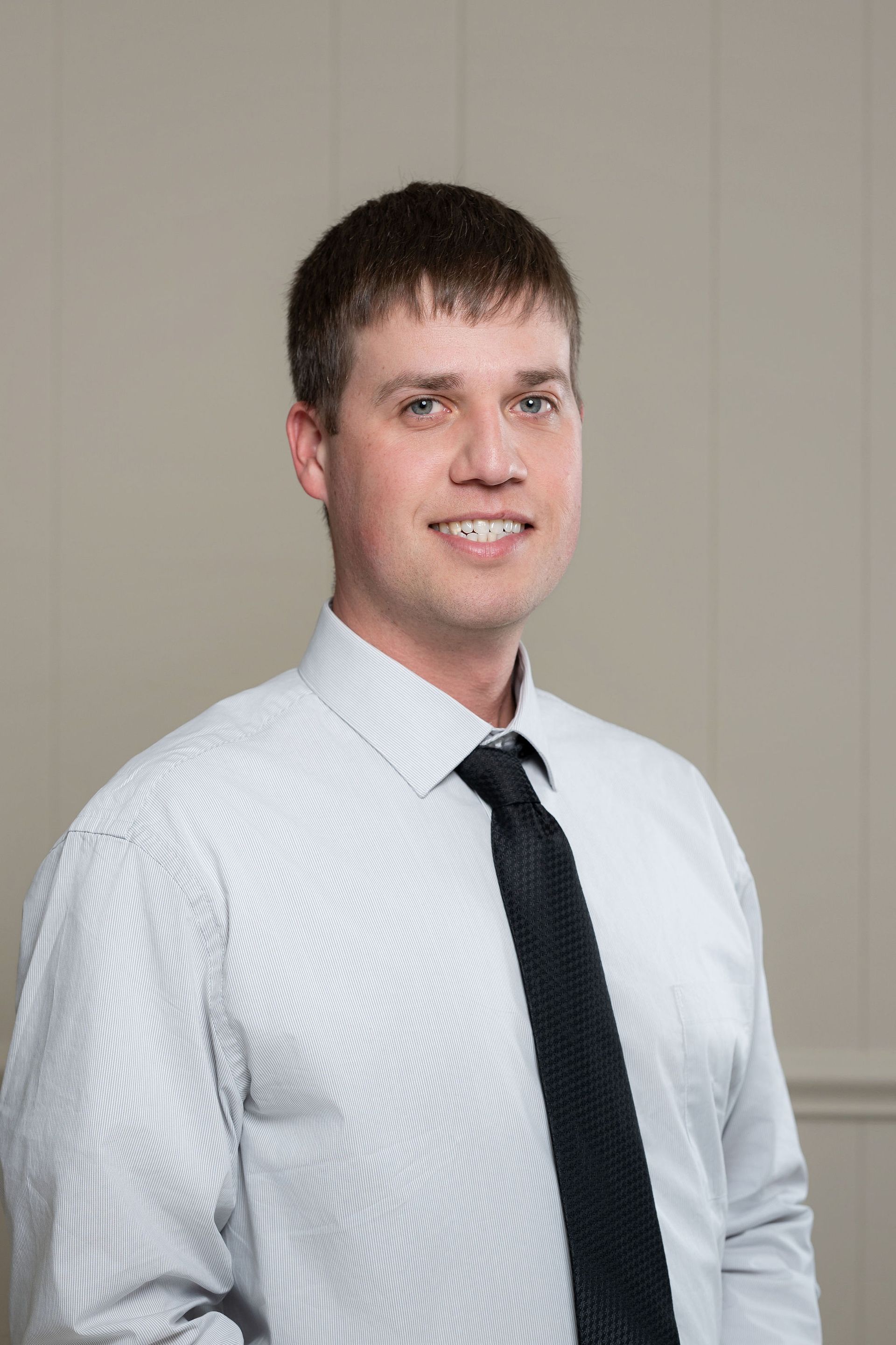 A silhouette of a woman without a face on a gray background.