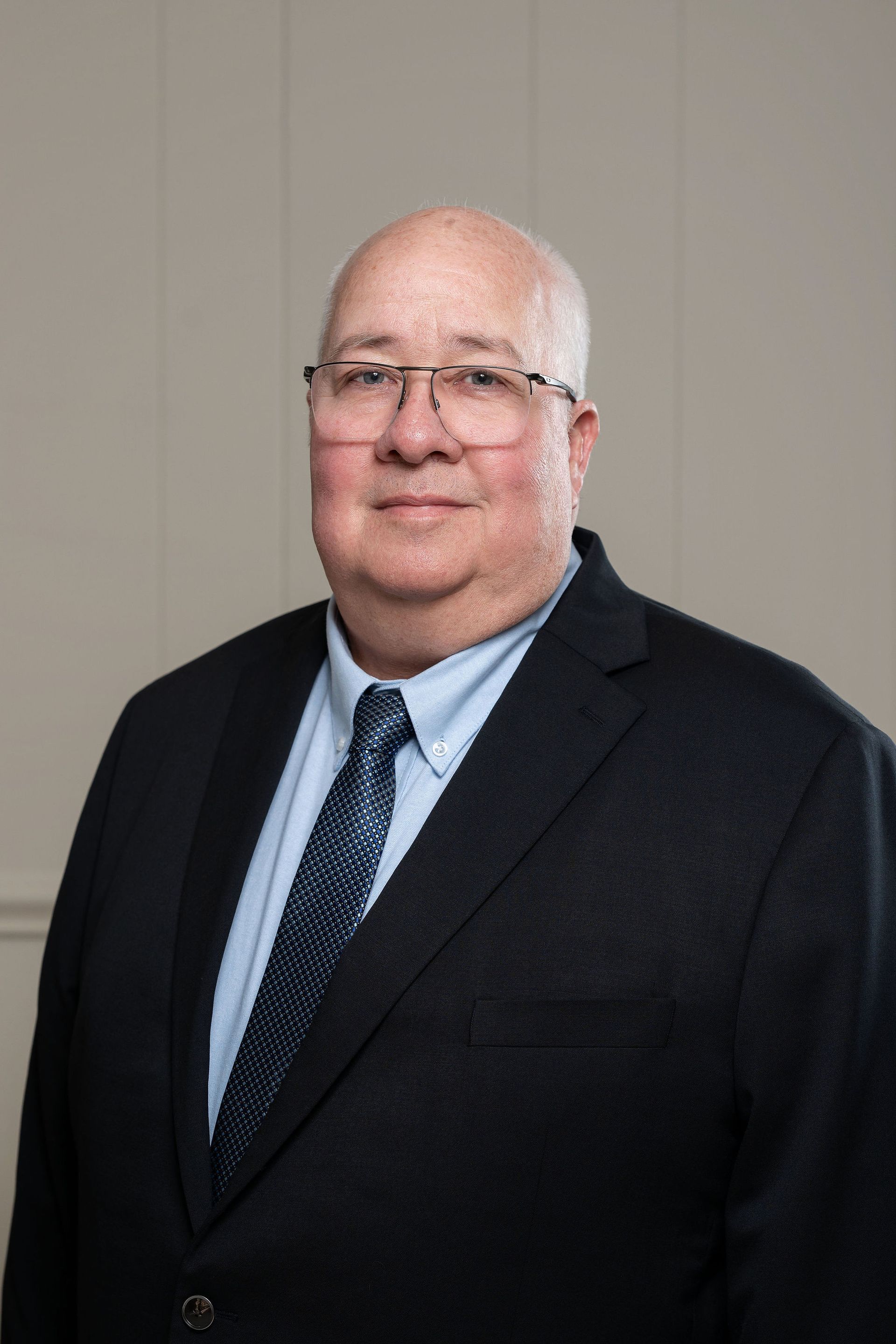 A silhouette of a woman without a face on a gray background.