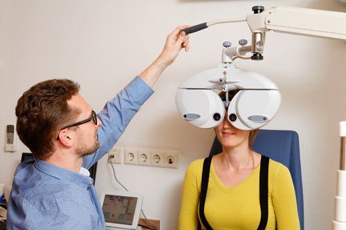 Professional optometrist testing the eye