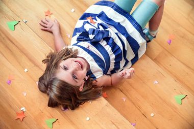 Child Happy Lying On vinyl  —  Floor Coverings In Goonellabah, NSW