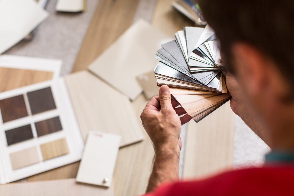 Woman Choosing Flooring— Floor Coverings In Goonellabah, NSW