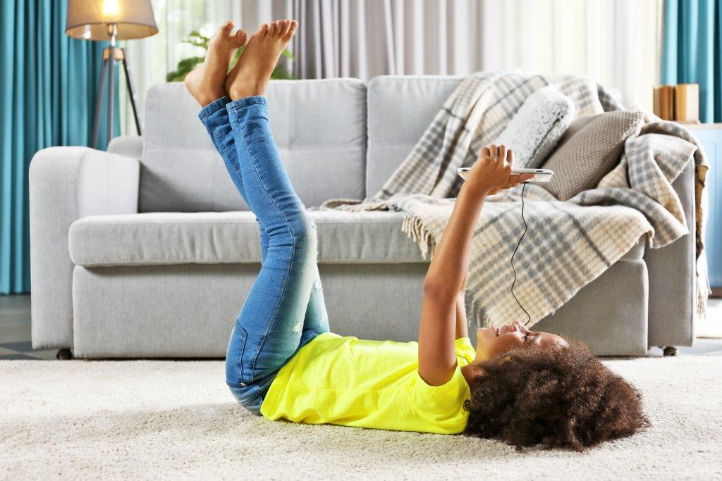 Young Women Laying On Carpet— Floor Coverings In Goonellabah, NSW