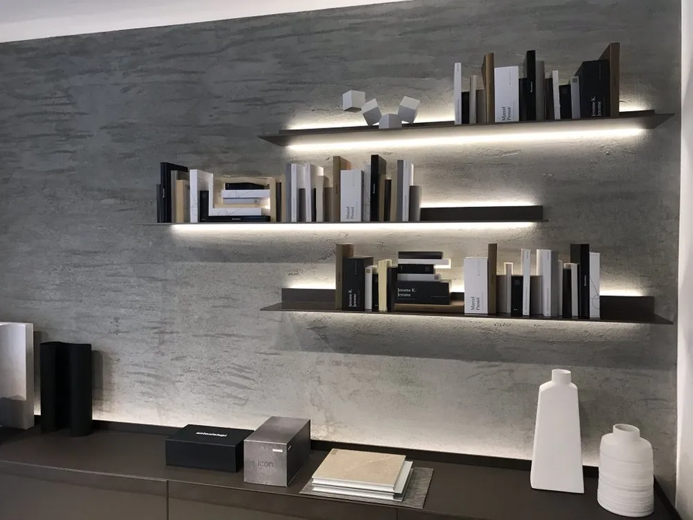 A bookshelf with a lot of books on it