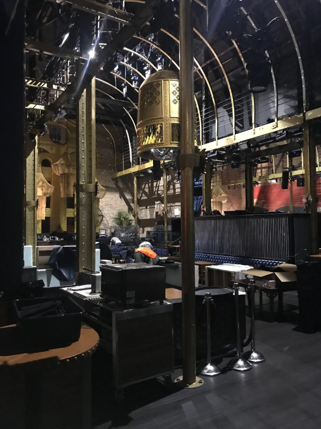 A large room with tables and chairs in it